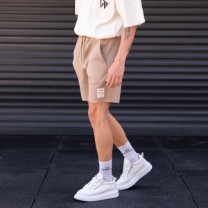 Pantaloncini beige oversize in tessuto da sub da uomo
