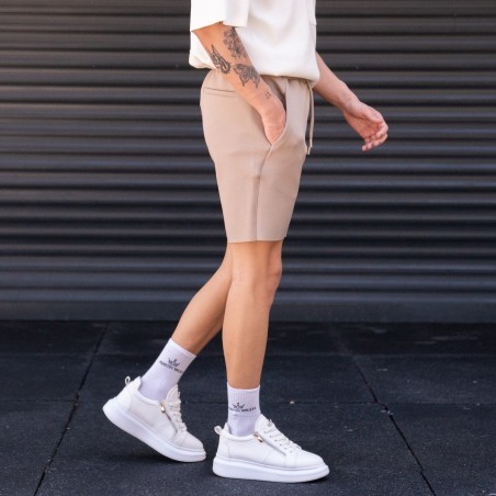 Pantaloncini beige oversize in tessuto da sub da uomo