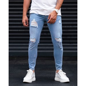 Ripped Slim Fit Jeans in Washed Blue