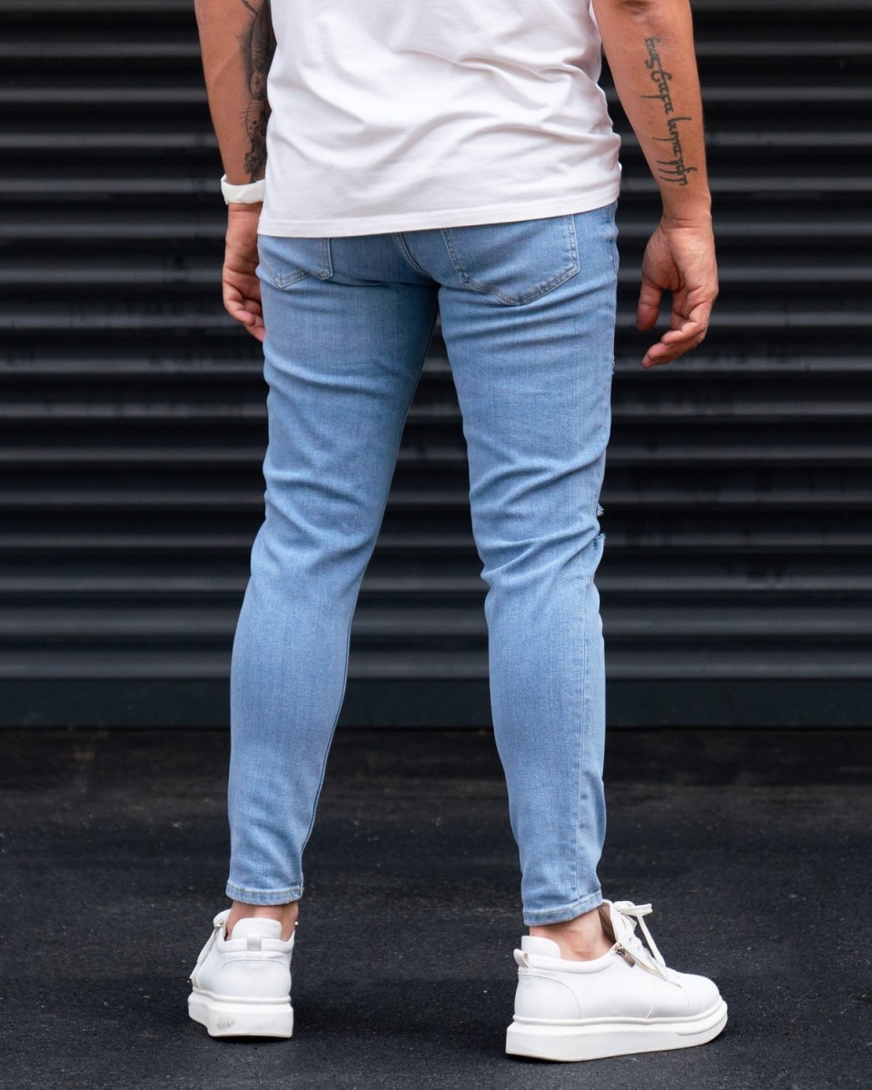 Ripped Slim Fit Jeans in Washed Blue